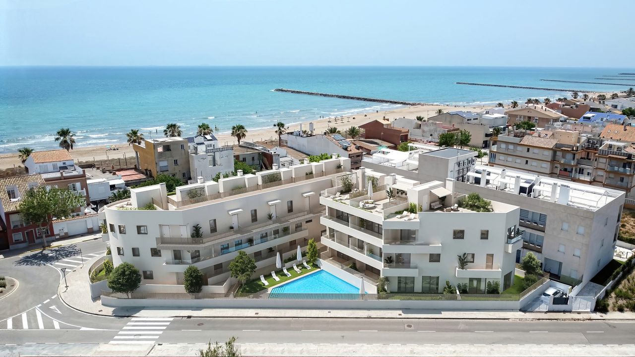 Obra nueva frente al mar — Render aéreo 3D de promoción residencial